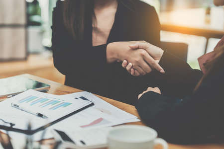 Business partnership meeting concept. Image business woman handshake. Successful business people...