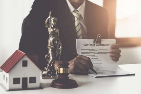Close up lawyer businessman working or checking contract in office workplace for consultant lawyer...