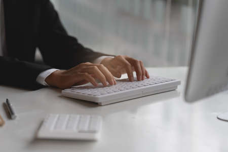 Asian Accountant checking tax and using calculator. Anti Bribery concept.の写真素材