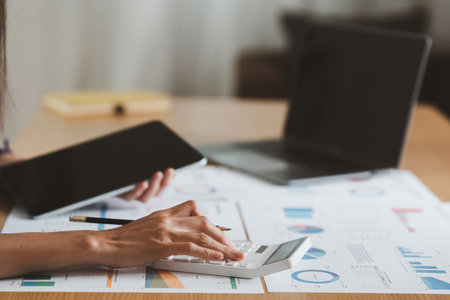 Asian Accountant checking tax and using calculator. Anti Bribery concept.の写真素材