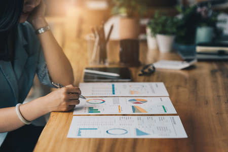 Business Finance audit tax Concept, Image of Asian Businesswoman calculate and audit investment tax and business strategy.の写真素材