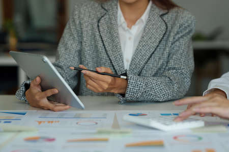 Group of Business people discussing and analyze financial project. Brainstorming and Finance concept.の写真素材