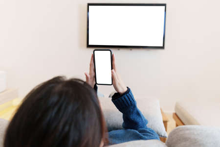 A Woman excited surprise and showing cell phone screen. Blank screen for your advertising.