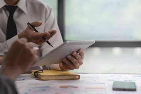 Group of businessperson analyzing financial report balance. Financial and investment concept.