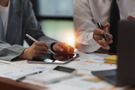 Group of businessperson analyzing financial report balance. Financial and investment concept.の写真素材