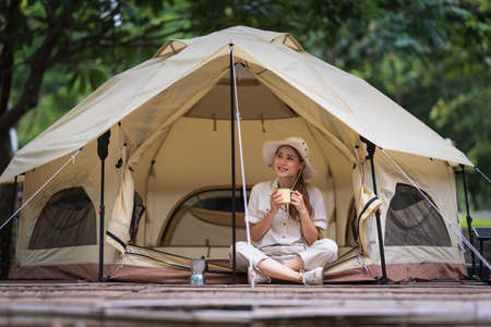 Asian woman journey and camping in Thailand. Travel outdoor activity lifestyle.