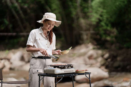 Asian woman journey and camping in Thailand. Travel outdoor activity lifestyle.の写真素材