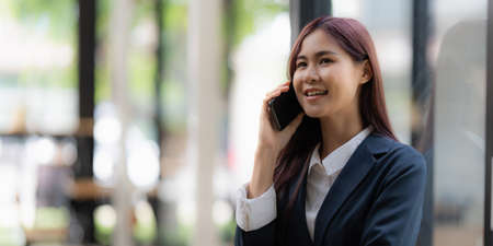 Business woman completes KYC using an online banking program in order to open a digital savings account. The definition of cyber security.の写真素材