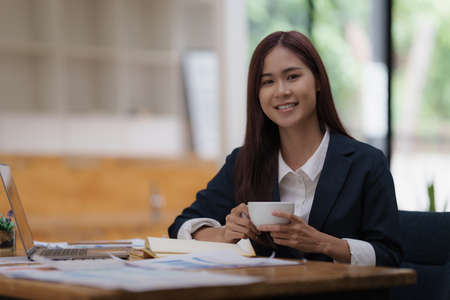 Image of Young woman working online on laptop computer. studying or working from home online concept.の写真素材