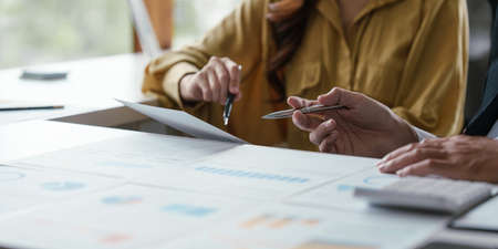 Group of businessperson analyzing financial report balance. Financial and investment concept.