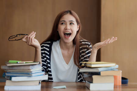 Back to school concept. Young woman excited while meeting friendの写真素材