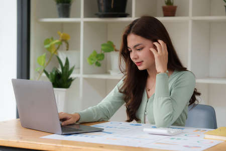 Business woman audit the company financial results and budget