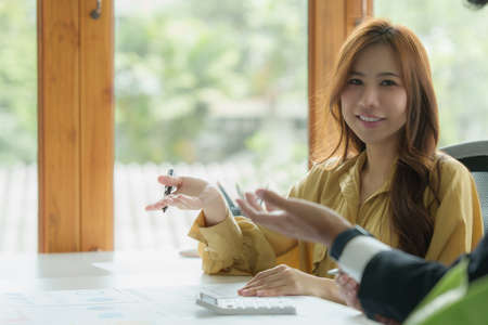 Administration or Accountant discussing with partner are meeting to audit finance planning sales to...