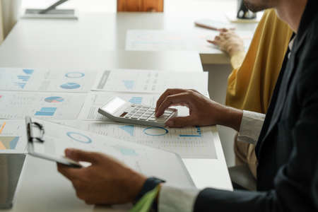 Administration or Accountant discussing with partner are meeting to audit finance planning sales to meet targets set in next year. Finance conceptの写真素材