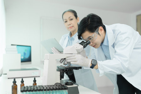 Group of science researchers working with test tube medical science laboratoryの写真素材