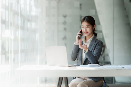 Business woman making business call talking on phone. Account and Finance conceptの写真素材