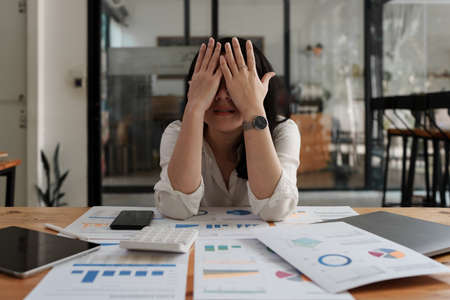 Asian business woman worry about marketing plan of this years. Account, Real Estate Agent, Finance concpetの写真素材