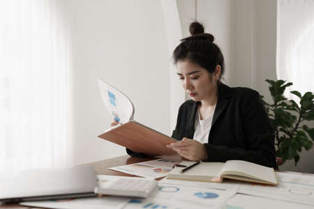 Modern business woman analysis financial with laptop applicationの写真素材