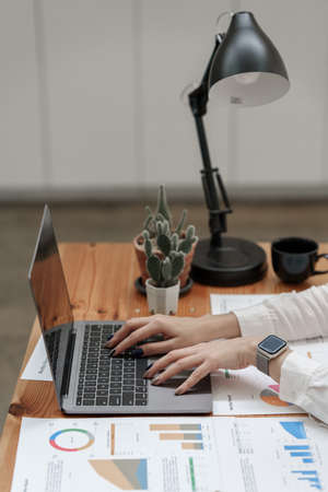 Business woman hand using laptop with bank savings account application, account or saving money or insurance conceptの写真素材