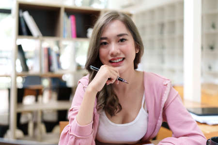 Modern business woman analysis financial paperwork document.の写真素材