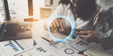 Fund managers team consultation and discuss about analysis Investment stock market by digital tabletの写真素材