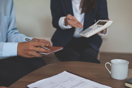 Real Estate Agent explain insurance and agreement contract to client before sign contractの写真素材
