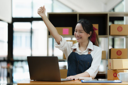 Asian small business owner working at home office. Business retail market and online sell marketing delivery, SME e-commerce conceptの写真素材