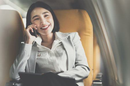 Asian Business woman talking with client before go to meet and deal big project. working and travel...