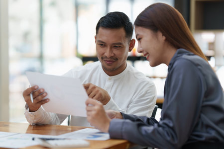 Two asian fund manager brainstorming new business project finance investment conceptの写真素材