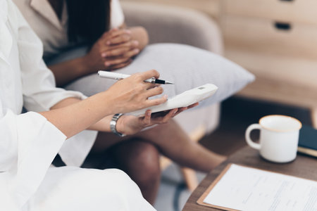 Real Estate Agent explain insurance and agreement contract to client before sign contractの写真素材