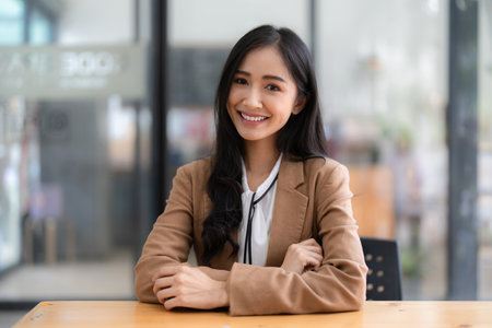 Smart asian business woman smiling at office space. real estate, lawyer, non-profit, marketingの写真素材