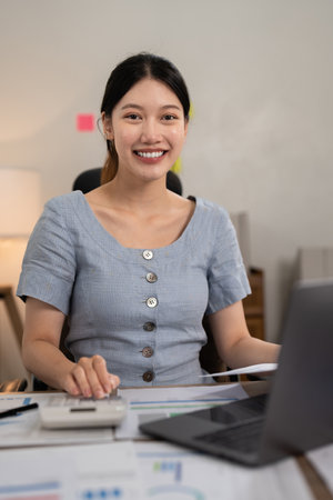 Asian woman working with laptop at home. work from home conceptの写真素材