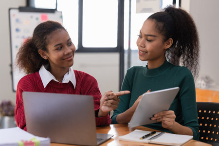 Two Black Business women at casual meeting room discussing and brainstorm idea about marketing. Business consult conceptの写真素材