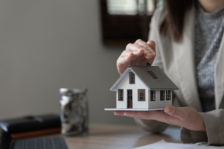 Real estate agent and customer discussing for contract to buy house, insurance or loan real estate backgroundの写真素材