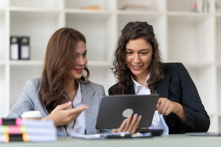 Business advisers are gathering to assess and debate the issue as it appears on the financial report. Financial counselor, investment consultant, and accounting conceptの写真素材