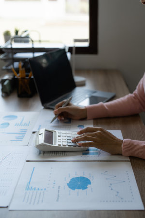 Business advisers are gathering to assess and debate the issue as it appears on the financial report. Financial counselor, investment consultant, and accounting conceptの写真素材