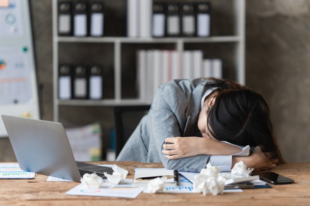 Stressed Asian business woman worry about marketing plan of this years. Account, Real Estate Agent,...