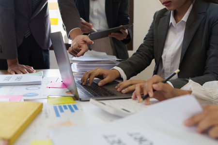 Group of Fund manager and Accountant checking data document on digital tablet for investigation of corruption accountの写真素材