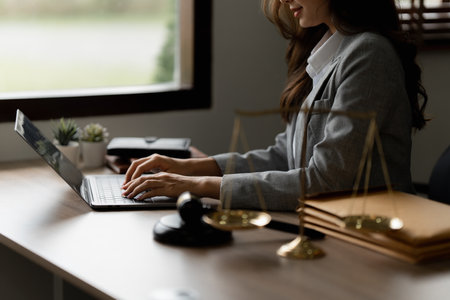 Lawyer business woman working or reading agreement contract in office workplace for consultant lawyer conceptの写真素材