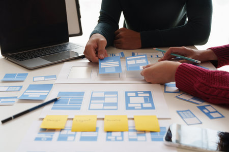 Group of ux developer and ui designer brainstorming about app interface design at modern office....