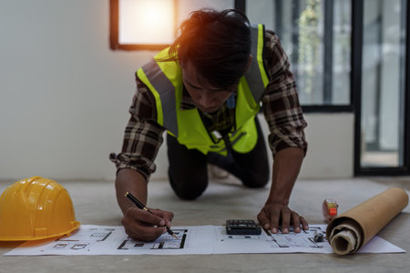 Professional architect designer structural engineer working with blueprint design project.の写真素材