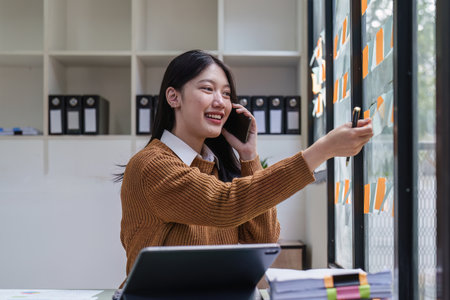 Asian Business woman working at home office and analyze financial report document. Accounting and...