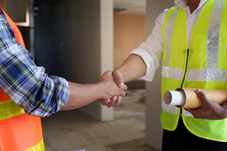 Professional architect designer structural engineer team colleagues discussing building plan design projectの写真素材