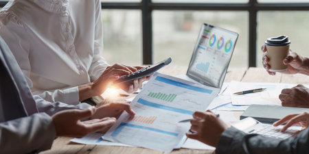 Group of Business people meeting for analysis data figures to plan business strategies. Business...