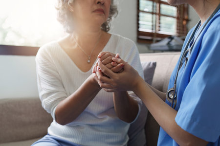 Asian youthful nurse caring for patients or the elderly at home. nursing at home conceptの写真素材