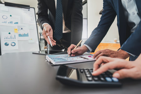 Financial analyst analyzes business people investment consultant analyzing company financial report working with documents graphs. Stock Market Tax Fund Finance conceptの写真素材