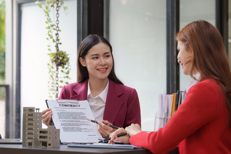 Real Estate Agent explain insurance and agreement contract to client before sign contract. Property...