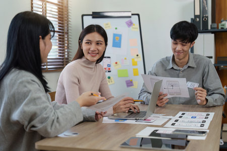 Young Asian Start up new business working at creative office. Modern start-up business team. Co-workers ui, ux startup small businessの写真素材