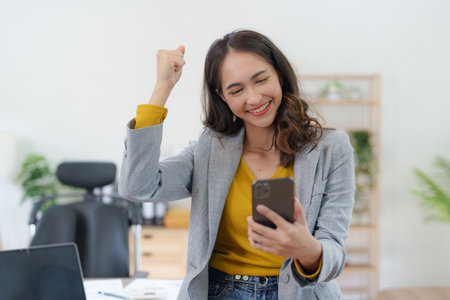 Asian Business People feels excited celebrating and working together success business goal