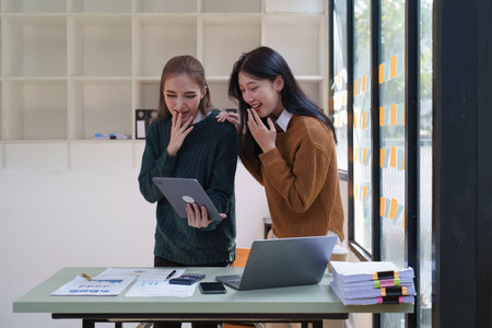 Asian Business People feels excited celebrating and working together success business goal